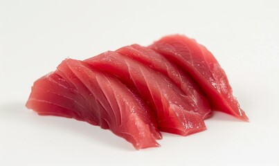 Tuna sashimi against a white backdrop