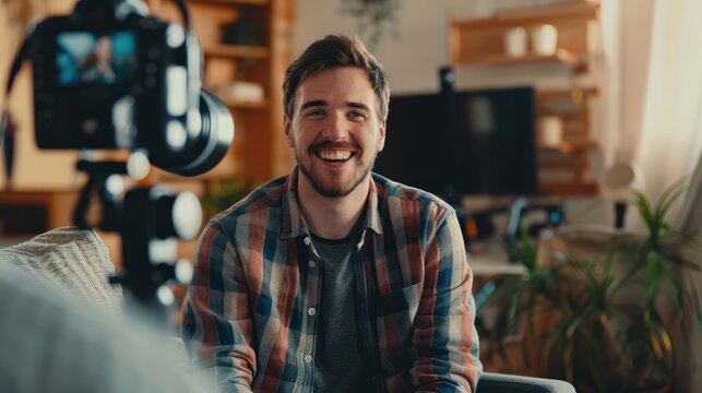 Smiling Man Being Interviewed on Camera. Cheerful man in a casual shirt sitting for an on-camera interview in a cozy room, giving a sense of approachability and openness.