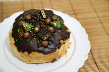 
Christmas sweet bread. Bread with Christmas decoration. Christmas food with chocolate in the shape of Christmas trees. Cake.