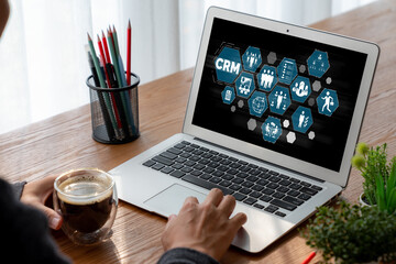 Fototapeta premium Customer relationship management system on modish computer for CRM business and enterprise