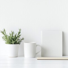 Minimalist white desk with a mug, plant, and blank canvas.