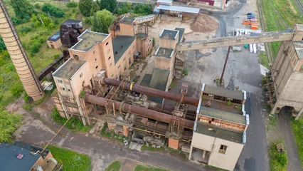 Fotobehang Verlaten Gebouwen Drone photography of old abandoned factory during summer day  © M
