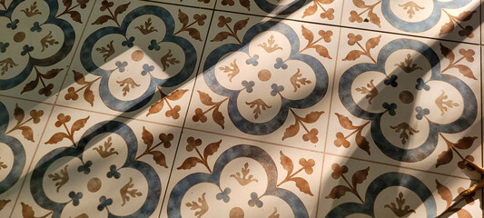 decorative blue and yellow Portuguese flooring, illuminated by the sun