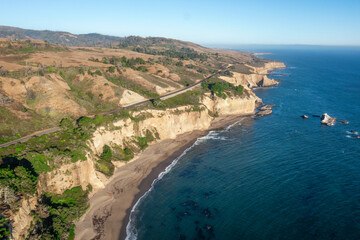 Aerial view of beautiful landscape along Highway 1 in California. Greyhound Rock and beach in the background. USA, travel and vacation concept
