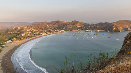 High point panoramic view from Christ of the Mercy statue standing on a cliff above the bay of San Juan del Sur in Nicaragua.