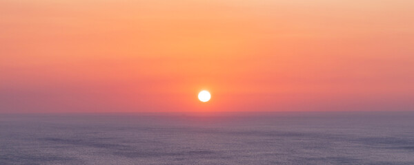 Background with beautiful warm tropical sunset at the Pacific coast in Central America