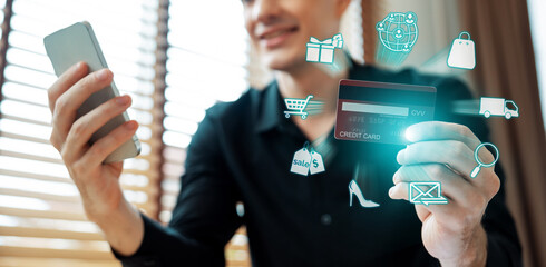 Elegant customer wear black shirt holding credit card choosing online platform. Smart consumer...
