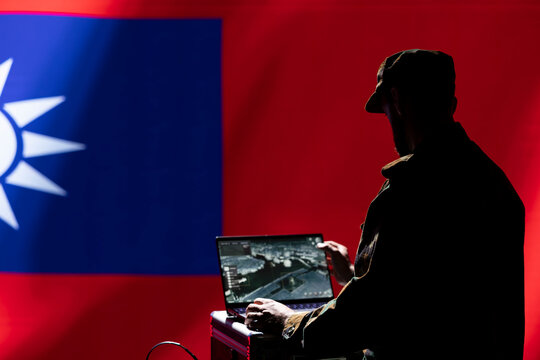 Intelligence officer isolated over Taiwan flag monitoring China border using radar. Taiwanese freedom fighter engaged in surveillance mission using laptop, looking at world map