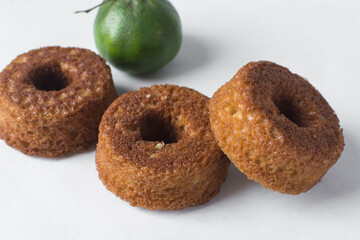 mini vanilla cakes on a white countertop, vanilla bundlettes on a white background, homemade small vanilla bundt cakes