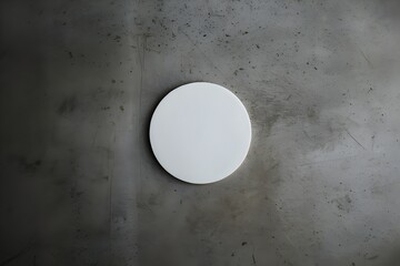 Minimalist White Coaster on Grungy Concrete Surface