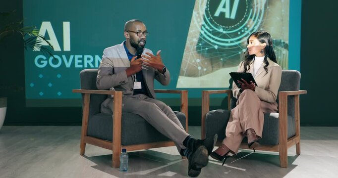 Conference, business people and speaker with host at stage for question, talk and speech at startup. Guest, technology and event at seminar for presentation on ai governance, policy and future rules