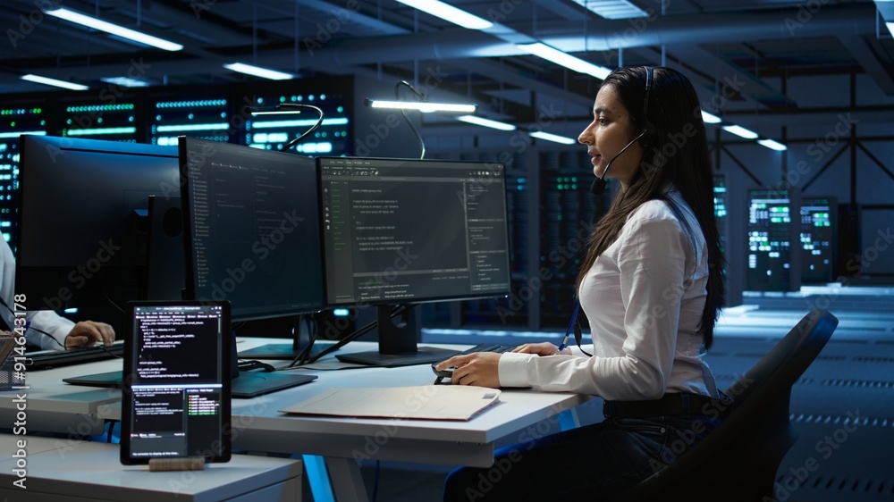 Poster technician in data center provides technical support to users, troubleshooting issues, close up. ser