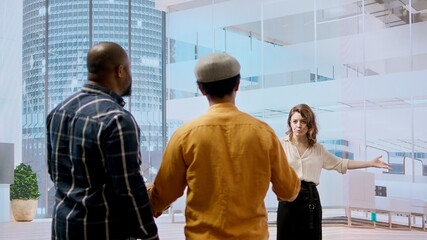 Business professionals and real estate agent evaluating detailed blueprints for a new office space, presenting their vision of the layout design. Considering potential property investment. Camera A.