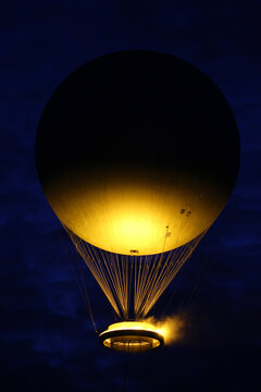 hot air balloon in the night, olympic flame paris 2024