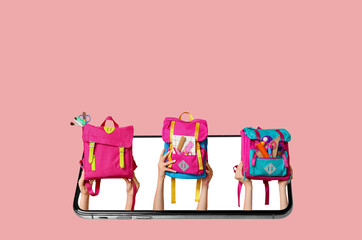 Female hands with backpacks and different school supplies on pink background, closeup