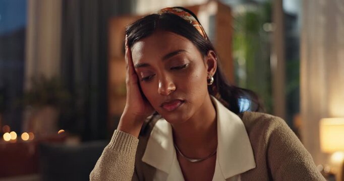 Stress, headache and sad woman in house with anxiety, fear and mistake, guilt and conflict trauma. Mental health, face and frustrated person overthinking divorce shame, loss or fail in living room
