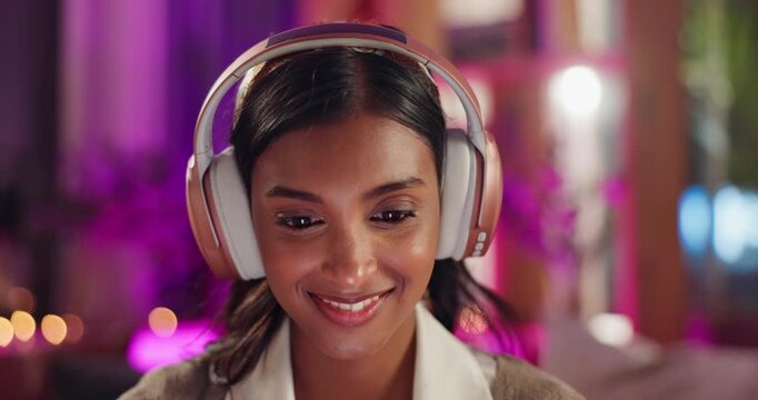 Woman, headphones and smile with social media, night and relax with technology and browse at home. Girl, listen and scroll with mobile app, fun and happiness in apartment with online music and meme