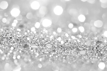 Obraz premium Silver glitter bokeh background. Perfect for adding a festive touch to designs.