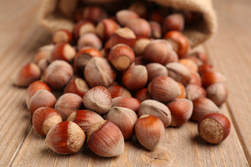 Shelled hazelnuts on wooden background