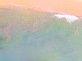 Beautiful sea beach and waves texture in sunny summer day background