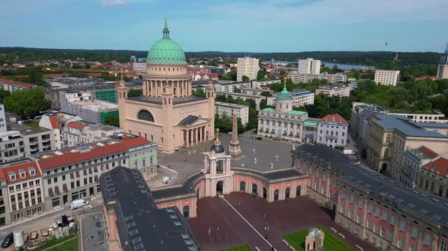 Potsdam Nikolaikirche church, market square. Dramatic aerial view flight drone