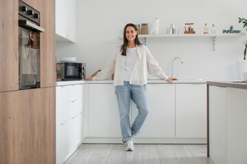 Young pretty woman in modern kitchen