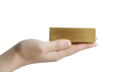 Hand holding gold bar on transparent background