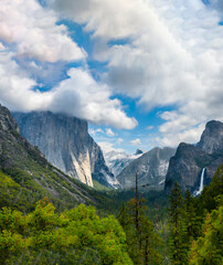 Beautiful Tunnel View with waterfall. El Capitan with cloud on top. Yosemite national park, California.
