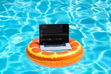 Summer business. Freelance style. Remote working in swimming pool. Summer travelling. Business at...