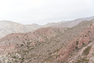 Andean misty scenery in the province of Mendoza, Argentina. The edge of the mountains can be seen through the fog.