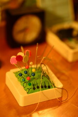 A pin cushion, pin holder, pin catcher.
