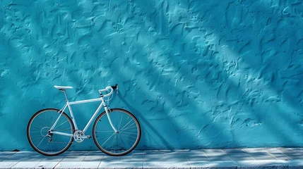 Fototapete The bicycle stands against the background of a blue wall copy space High quality photo : Generative AI © Sudaporn