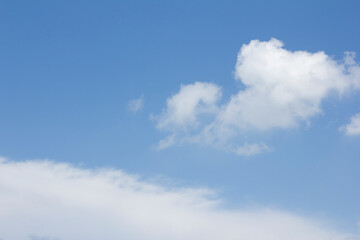 
Blue sky and white puffy clouds