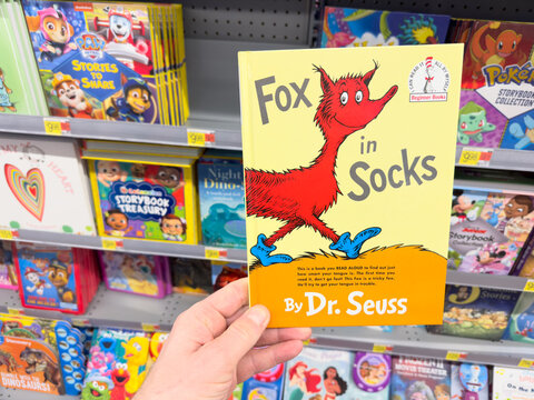 Fox in Socks book by Dr. Seuss inside a bookstore.