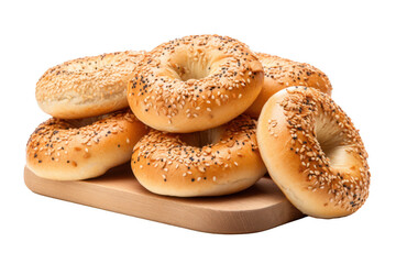 A wooden board with a stack of sesame seed bagels on it