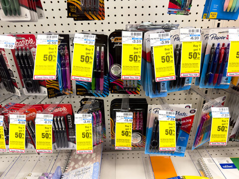 50% OFF discount tags on school and stationary equipment inside a CVS store.