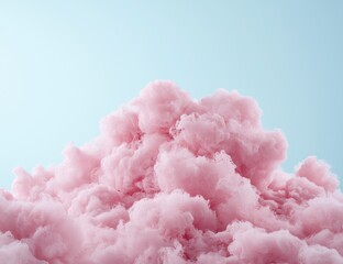 Fluffy pink clouds against a pale blue sky