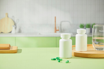 The front of unlabeled medicine boxes, green capsules, glasses of water and wooden trays are placed...