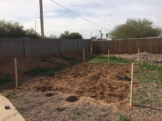 Putting up Posts for a Fence on In Ground Garden in Arizona Backyard