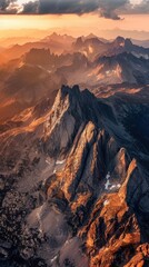 Obraz premium Golden Sunset Over Rugged Mountain Range