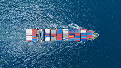 top view Cargo container ship carrying container and running in the ocean near international...