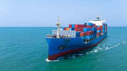 front view Cargo container ship carrying container and running in the ocean near international...