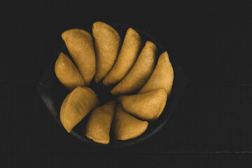 Delicious traditional Colombian empanadas with spicy sauce