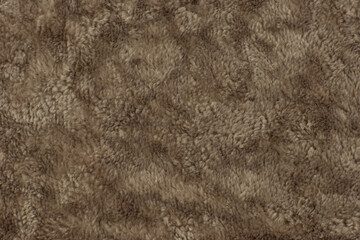 Texture background from fur fabric. Macro. The pile of fur fabric creates a chaotic pattern.