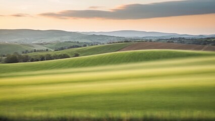 Obraz premium some buildings in a grassy field and clouds in the background,