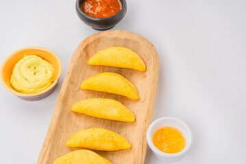 Colombian empanada with spicy sauce 