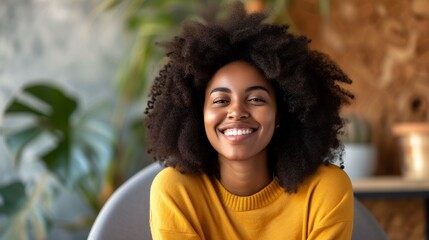 Smiling Woman With Afro Wearing Yellow Sweater In A Home Setting