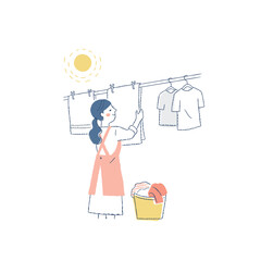 洗濯物を干している女性 © hisa-nishiya