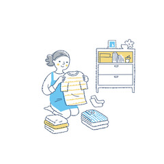 洗濯物をたたんでいる女性