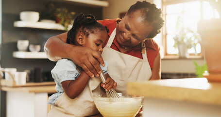 Baking, black child and grandmother in kitchen for support, recipe process and mixing batter at home. Young girl, development or senior woman at counter for trust, growth or encouragement making cake